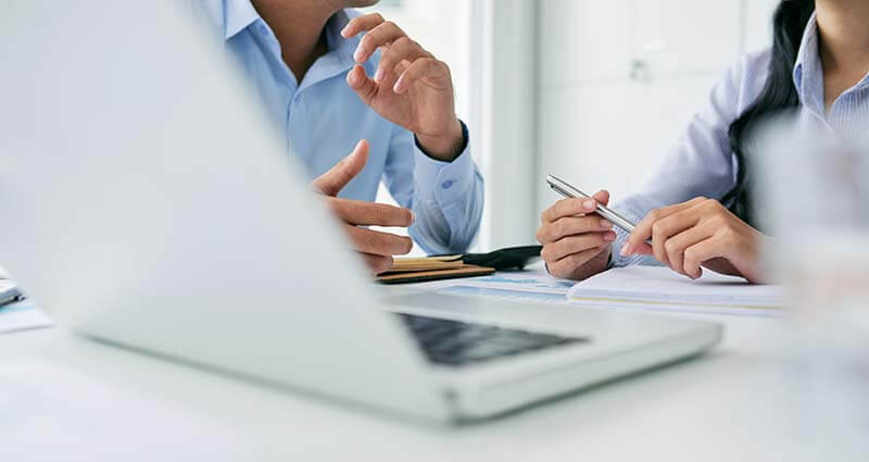 Business people in front of laptop