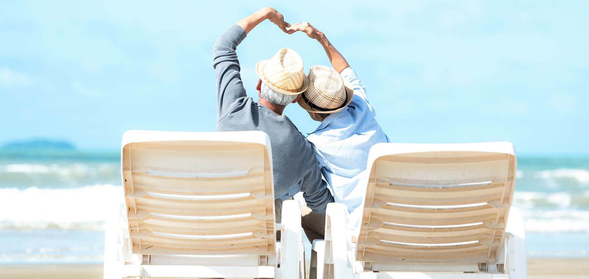 retired couple on beach