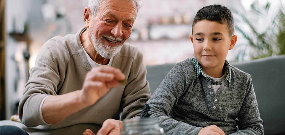 Man and child saving money